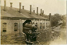Locomotive crash through roundhouse, ca. 1875-1885