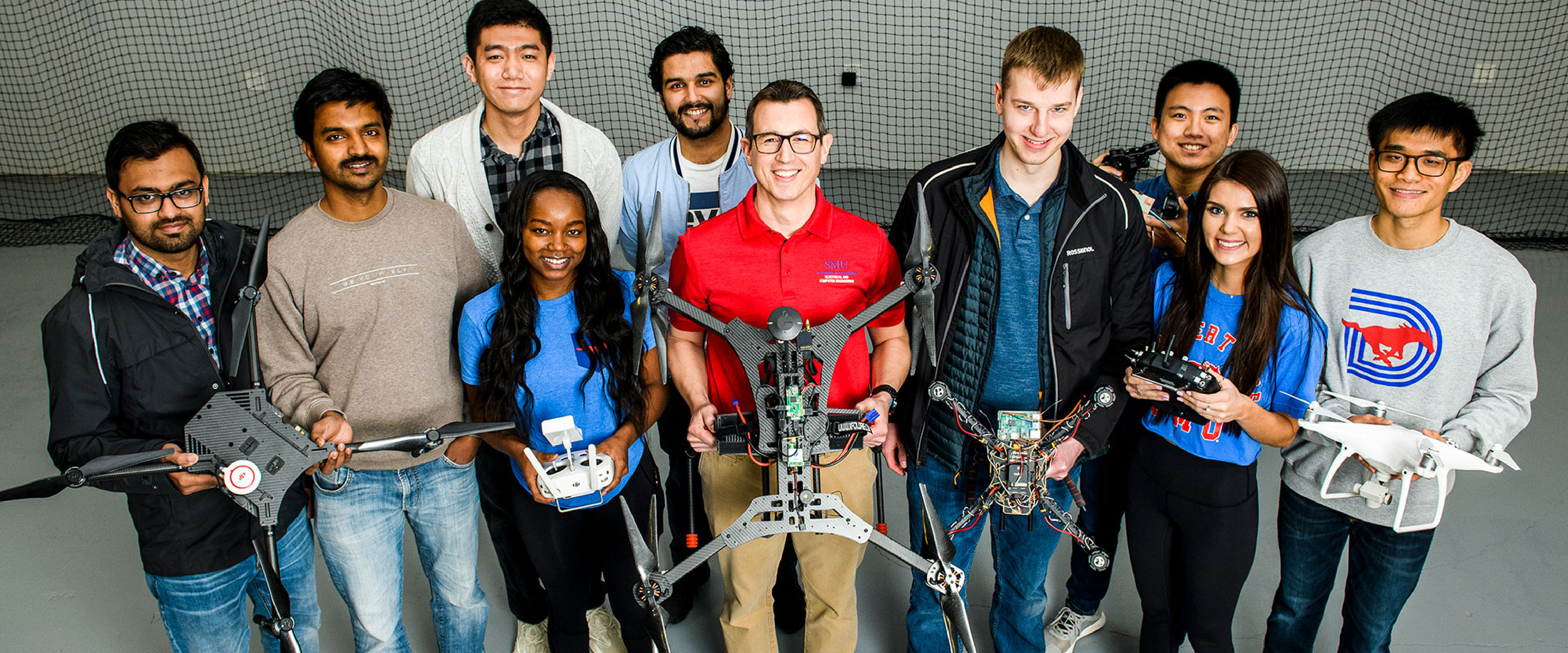 Group of students pictured with drone