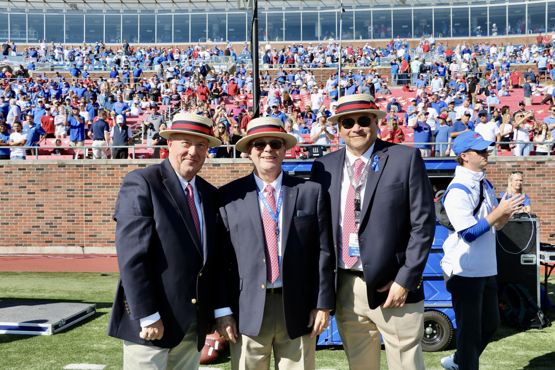 Jon Lee, Tommy Tucker, Charles Aguillon on Ford Stadium football field