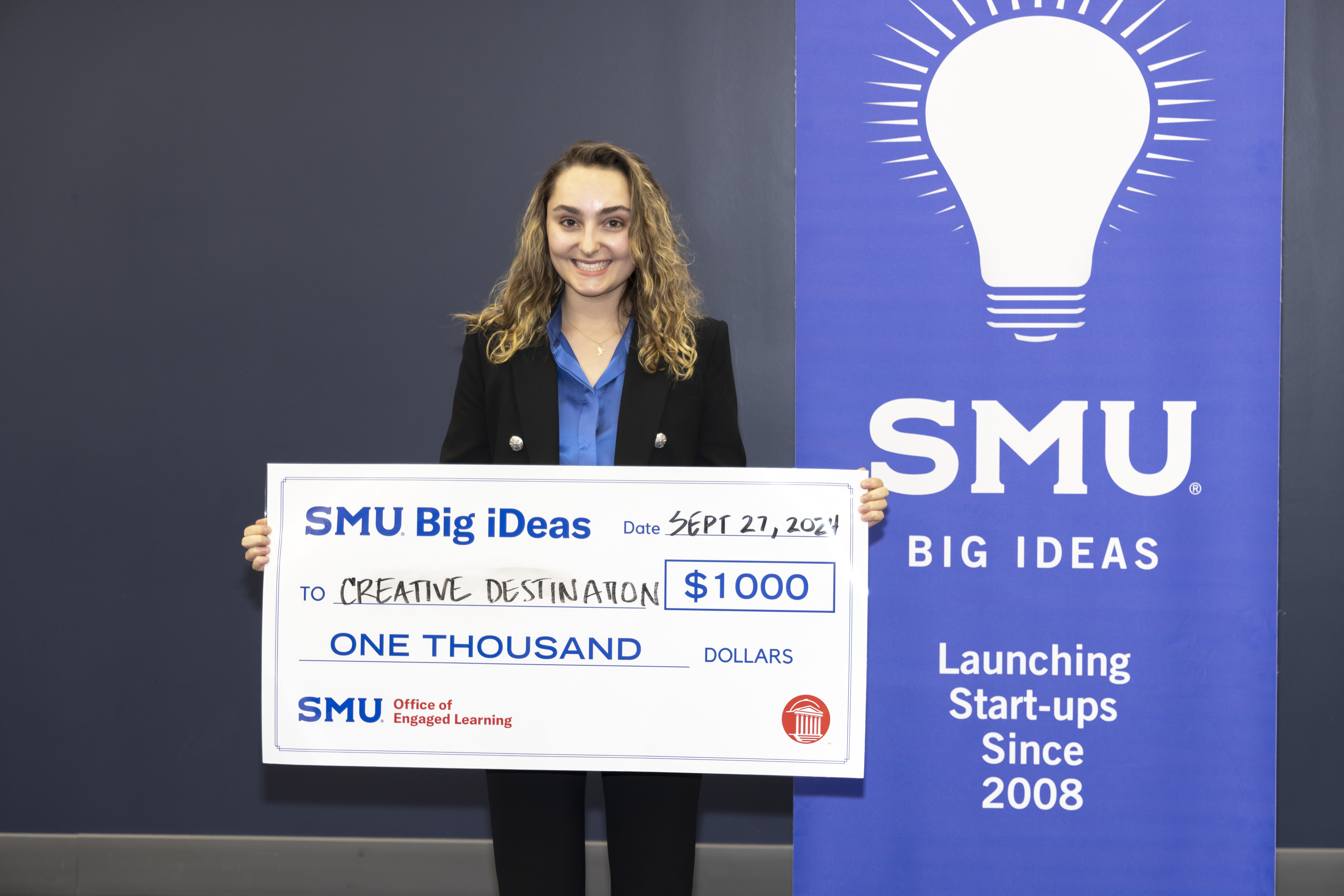 Ryland Adzich with her big check from Big iDeas