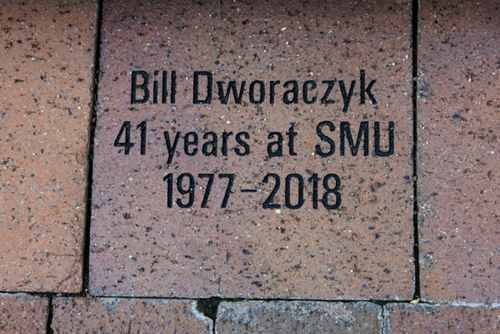 Square paver with three lines of text
