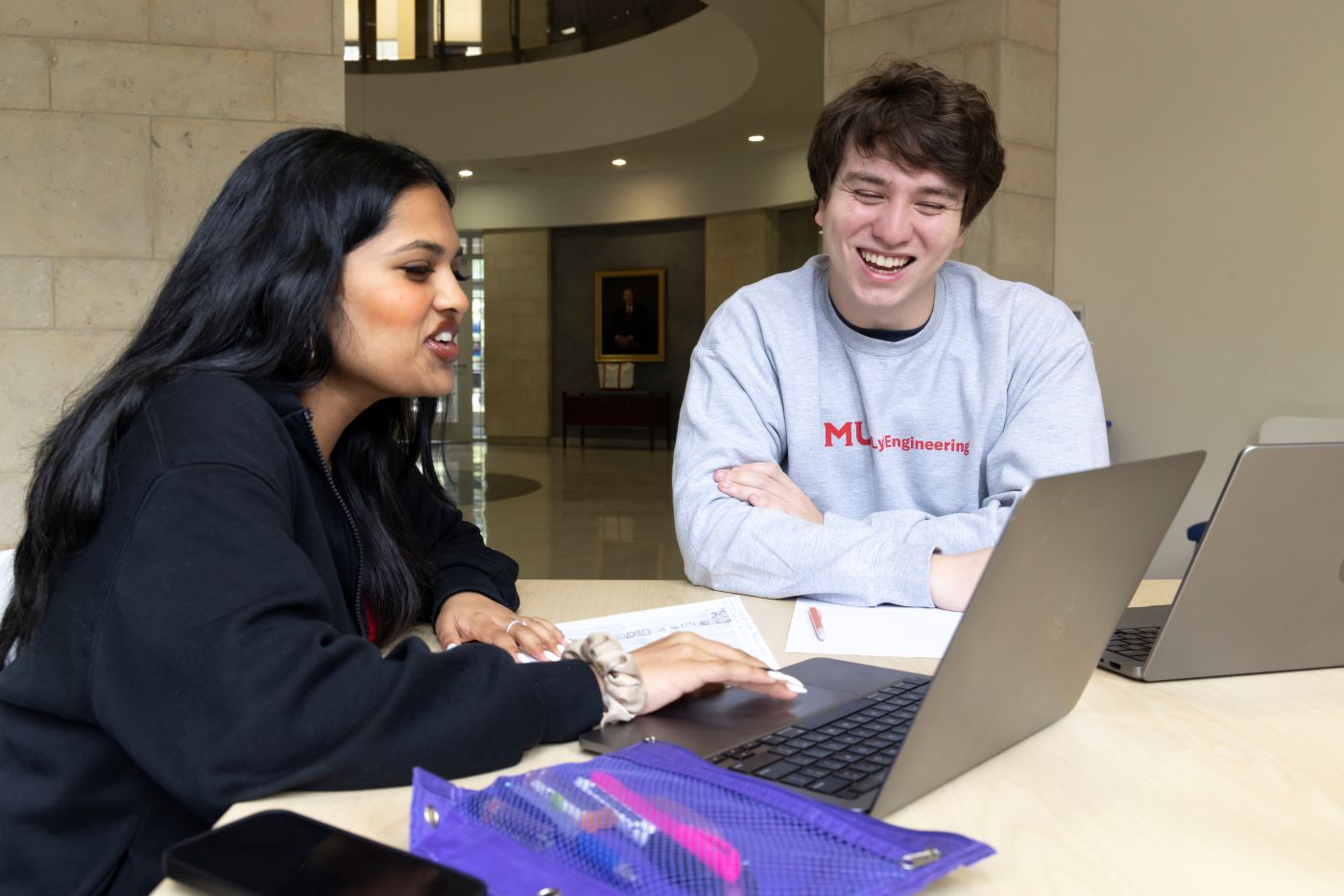 Lyle students smiling atrium