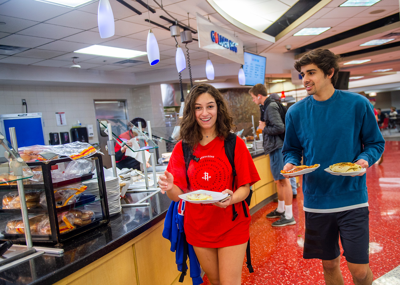 People getting their food at one of SMU's residential restaurants