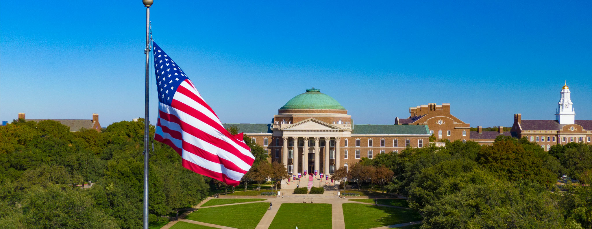 Dallas Hall with the flag