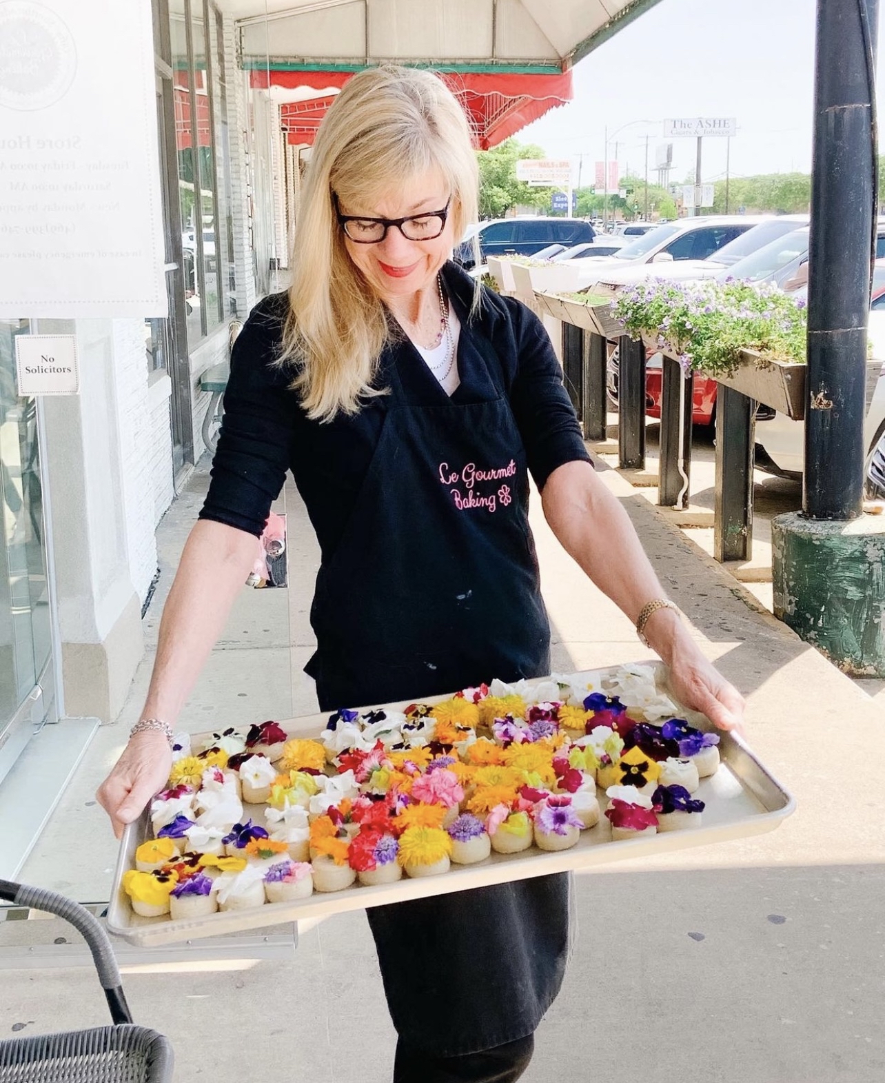 Becky holding a tray of cookies