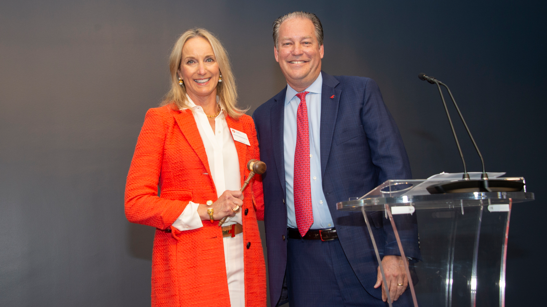 Kristin Henderson and George Killebrew pass the gavel