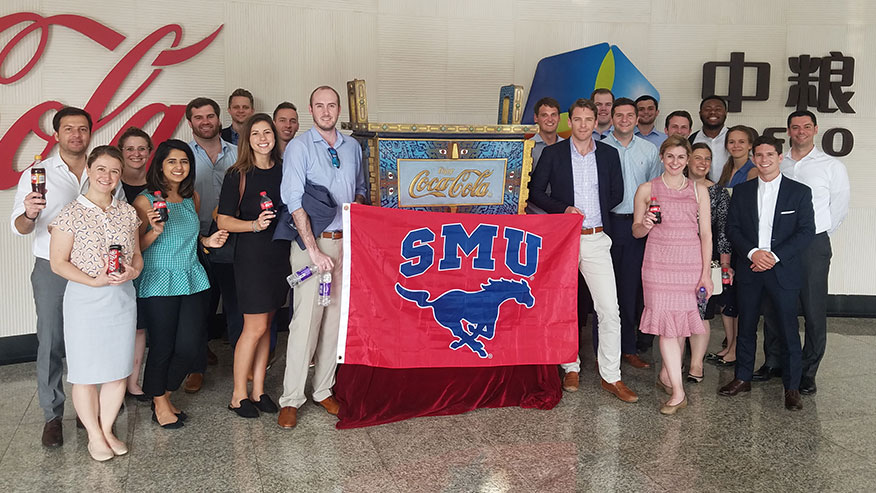 students holding SMU banner