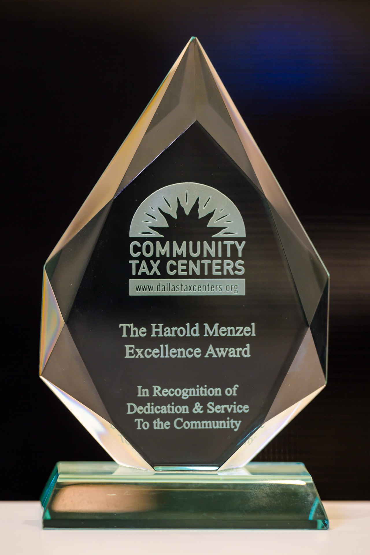 Close up image of Carlos de Dios' award