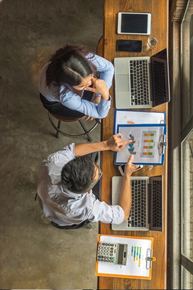 people at desk with computers