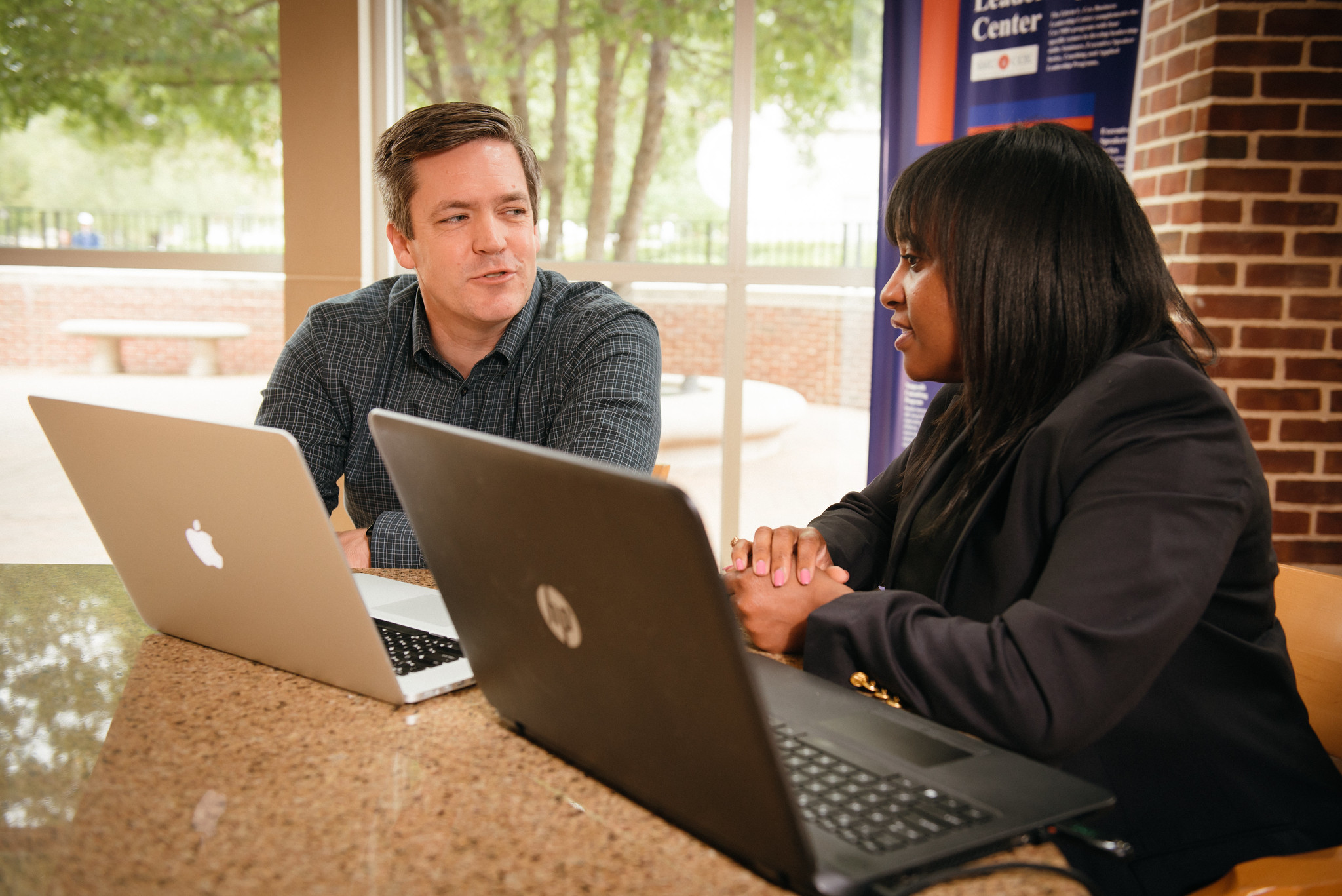 Photo of two MS students at a table