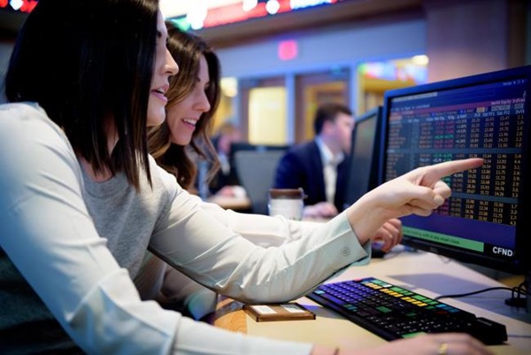 girl pointing at computer screen