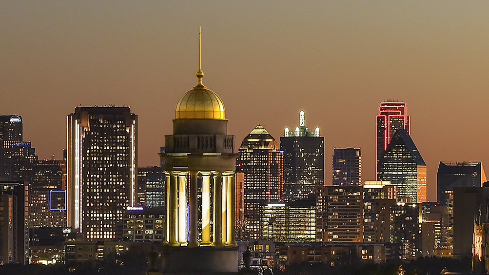 Photo of Fincher cupola in front of Dallas skyline.