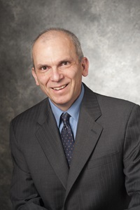 A headshot of Carlos Davila, a member of the Lyle School of Engineering Faculty.