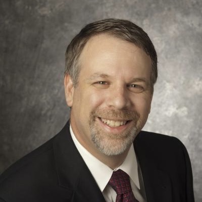 A headshot of Eli Olinick, a member of the Lyle School of Engineering Faculty.