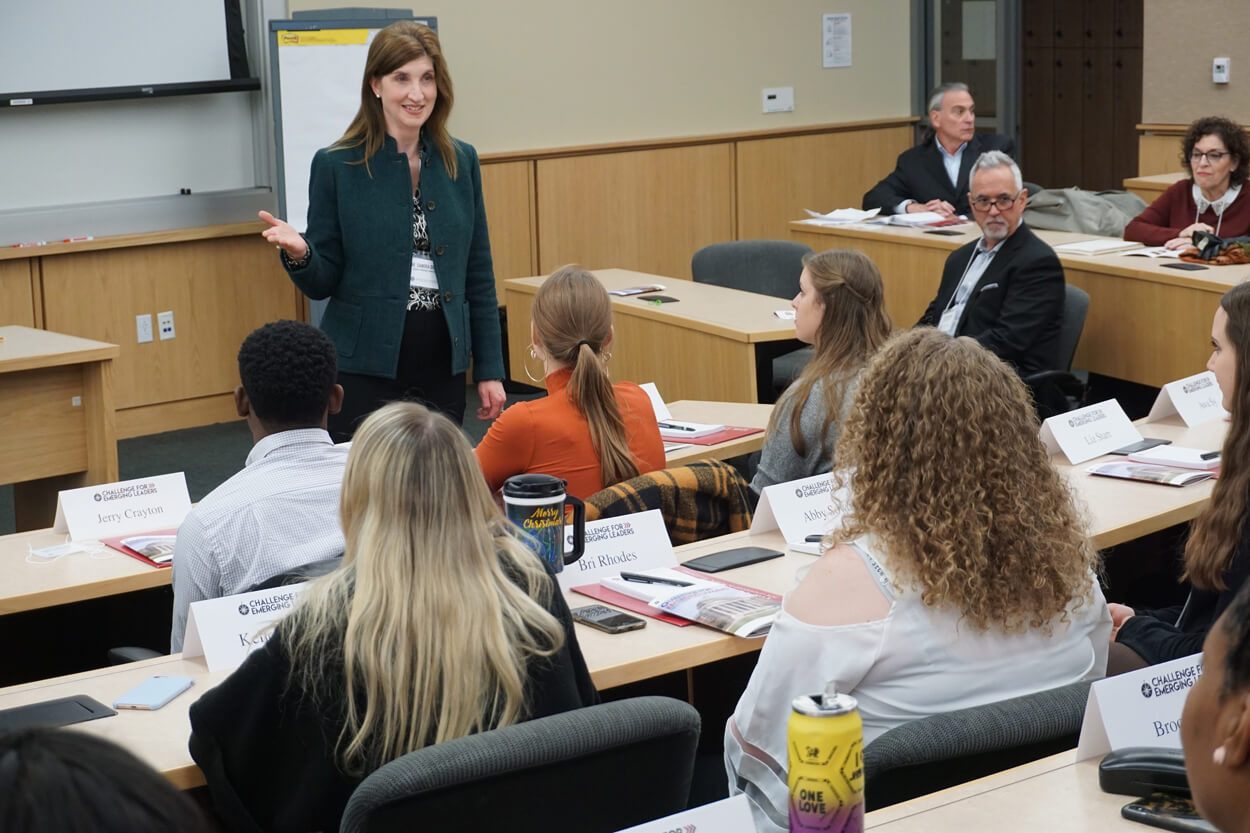 Dr. Sandra Duhe presenting at Plank Center workshop while fellow presenter Keith Burton (seated, in glasses) looks on