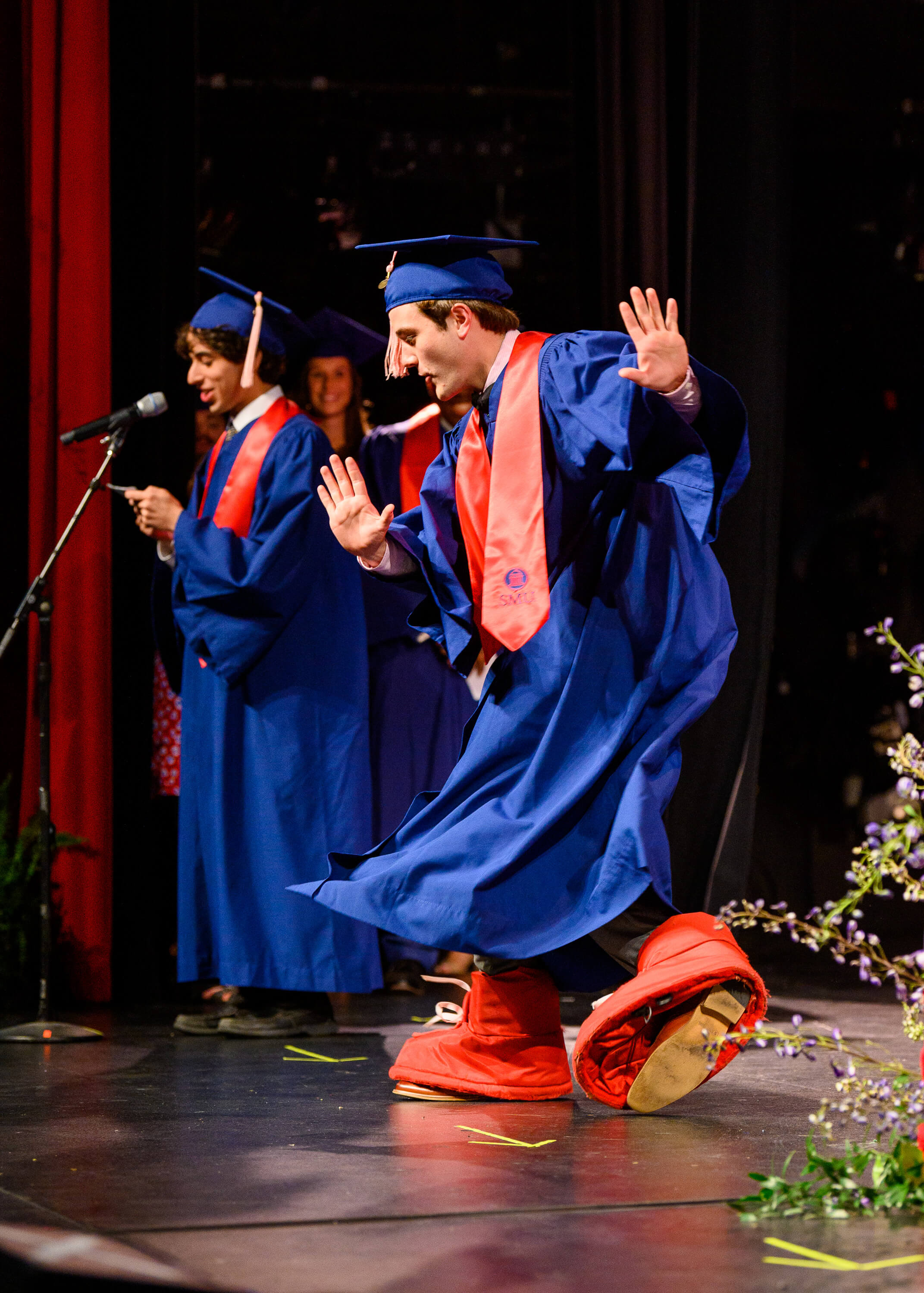 Graduation2022_StudentInBigRedShoes