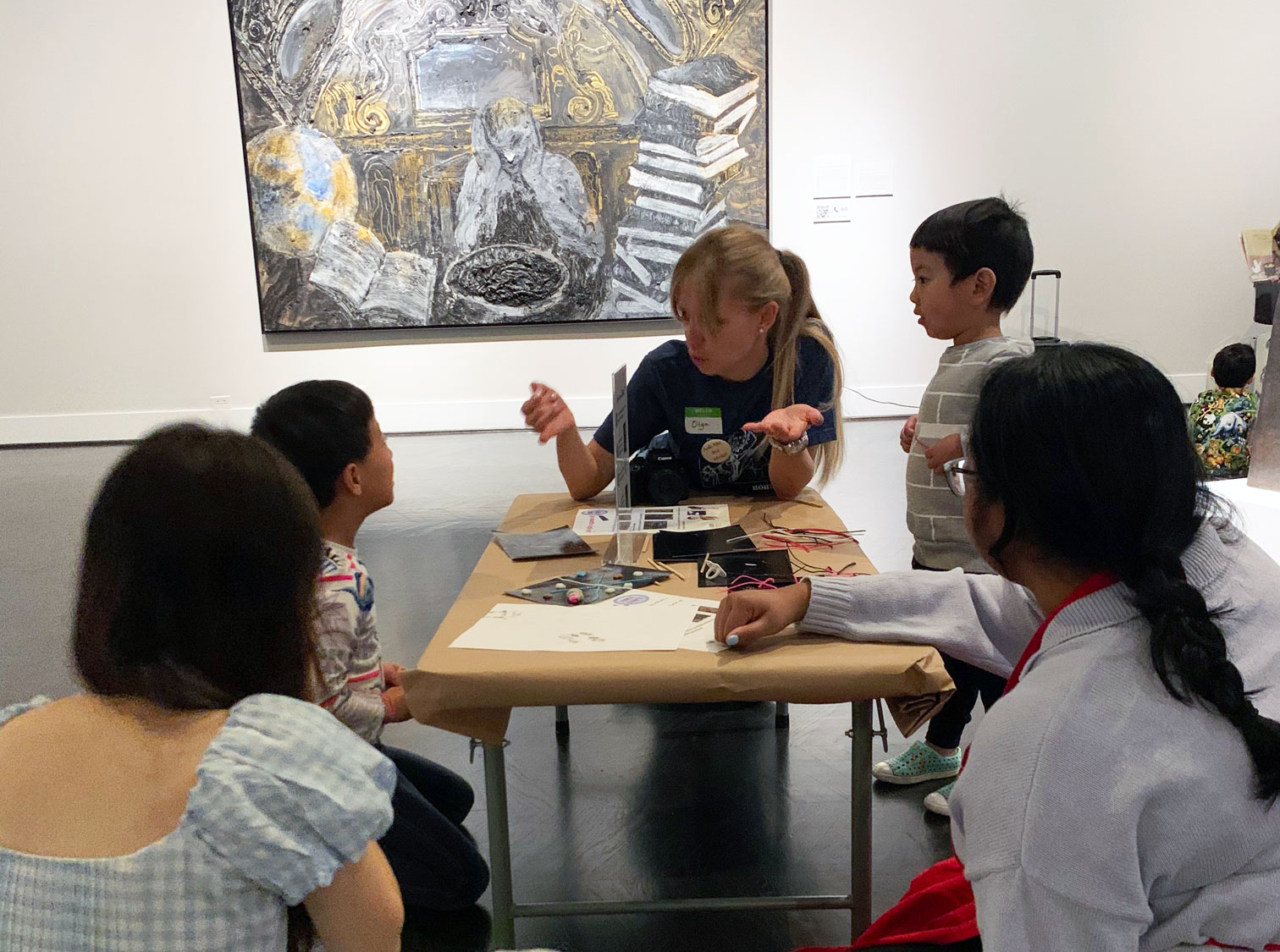 A student assists with family programming activities in a previous iteration of the Meadows Museum Student Corps.