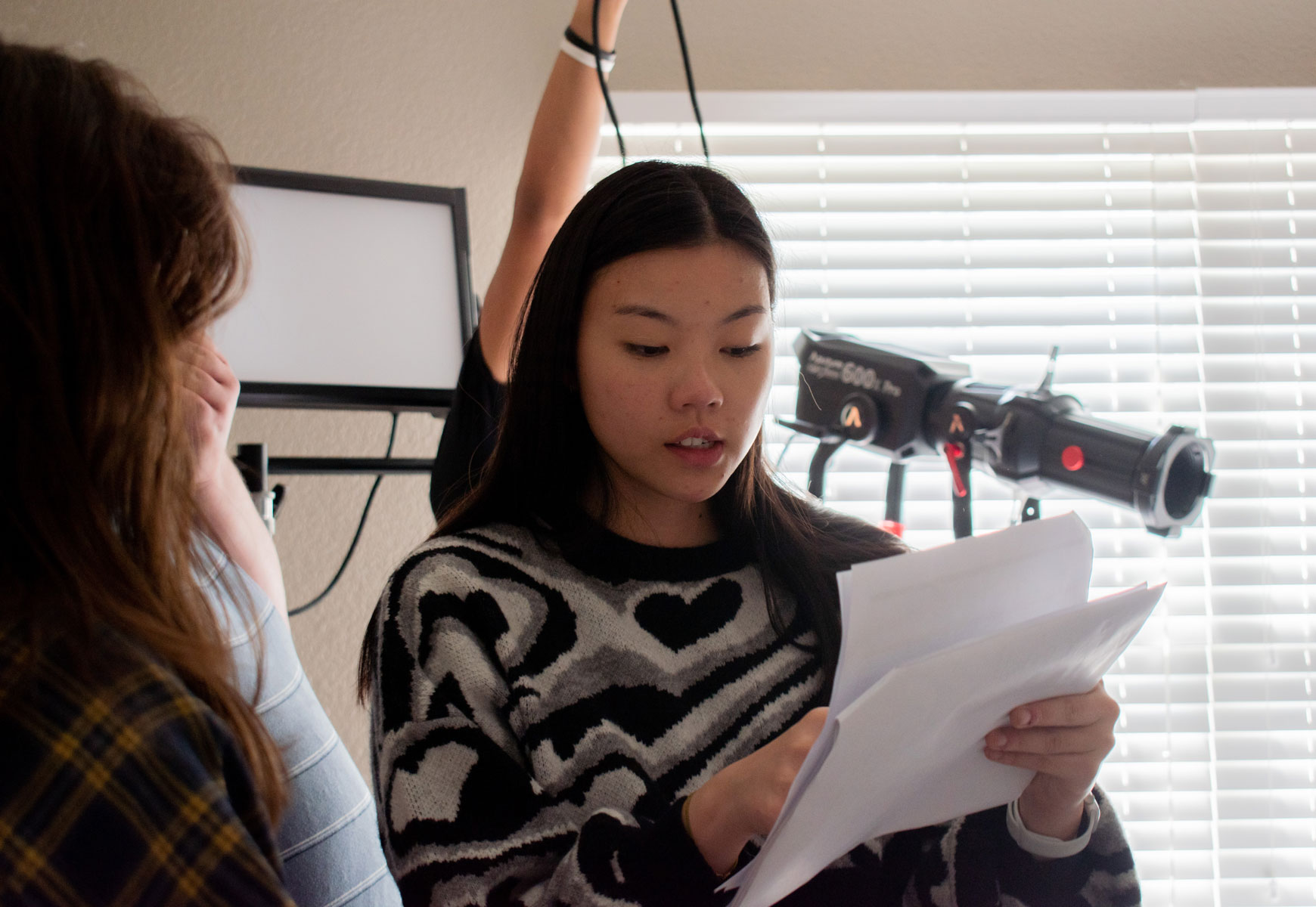 Film and psychology double major Alexa Derryberry works behind the scenes on the set of a short film.