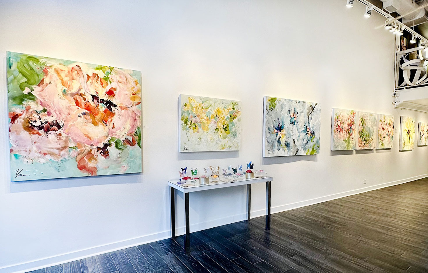 Paintings in an art gallery by artist Xan Sinclair Koonce