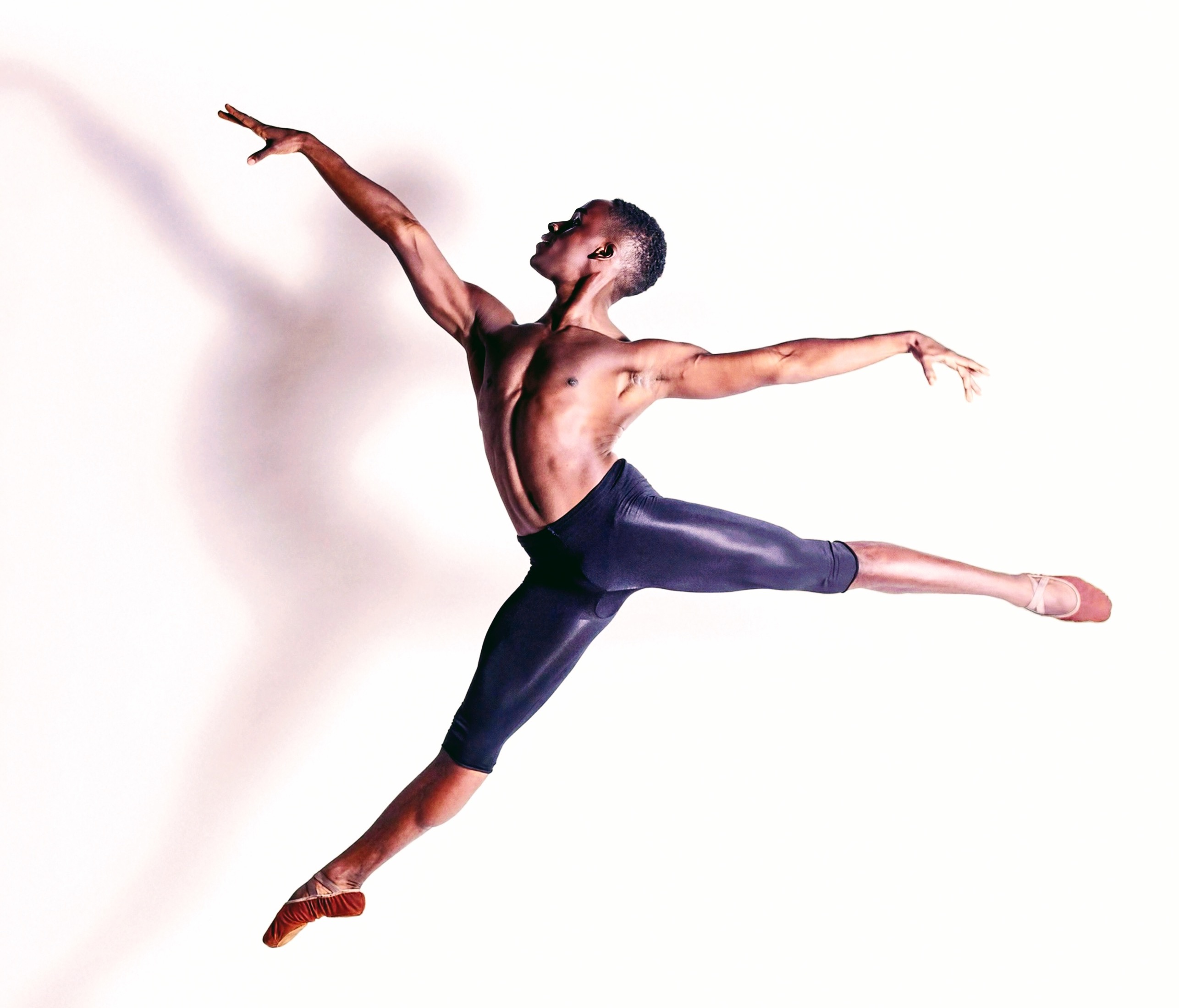 Dance alum TJ Hammond performs a dance ballet move