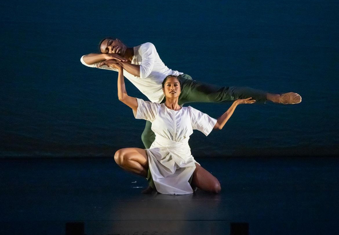 Dance alum Deepa Liegel performing on stage with another dancer