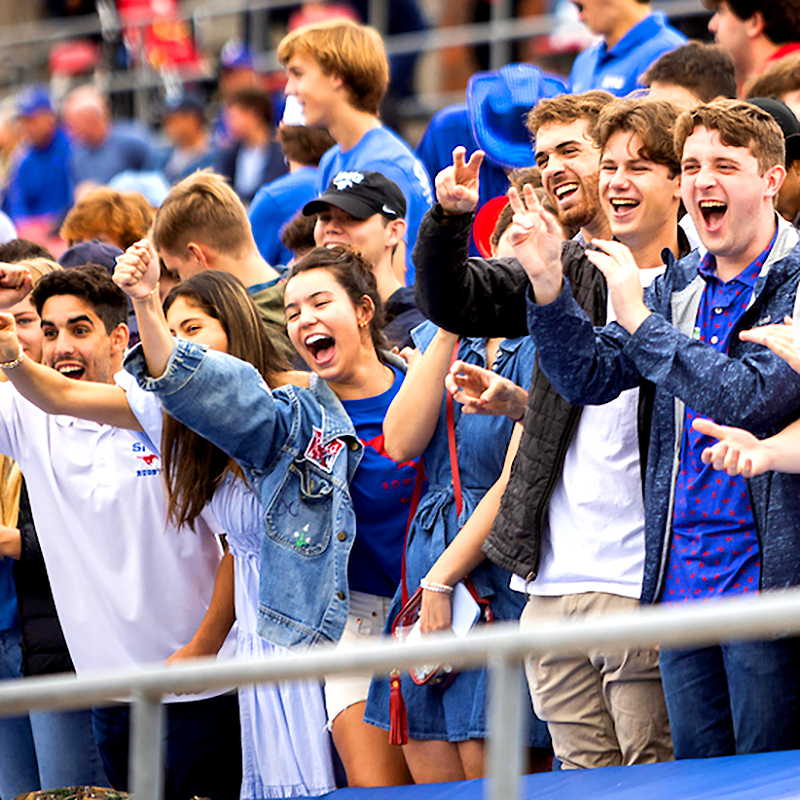 Students cheering at Ford Stadium