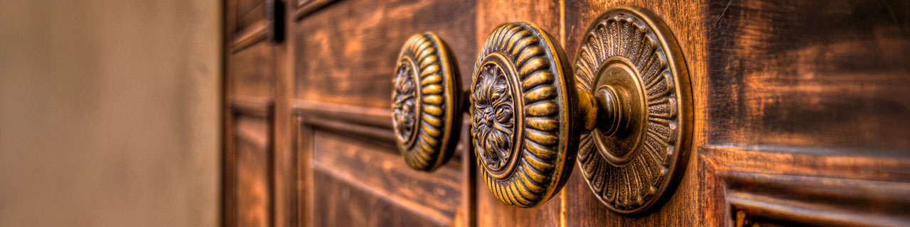 The intricate antique brass door knobs to the entrance of the original Meadows Museum.