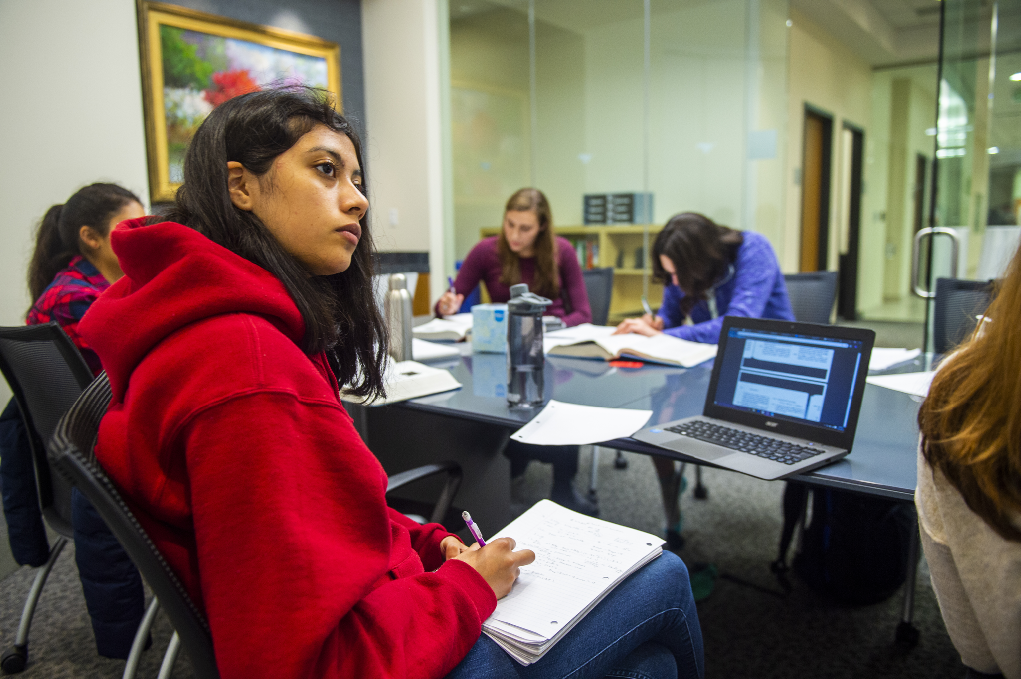 students listening at a table