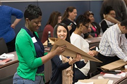 People gathered in a classroom engaging in learning activities