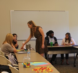 Professor assisting student in classroom