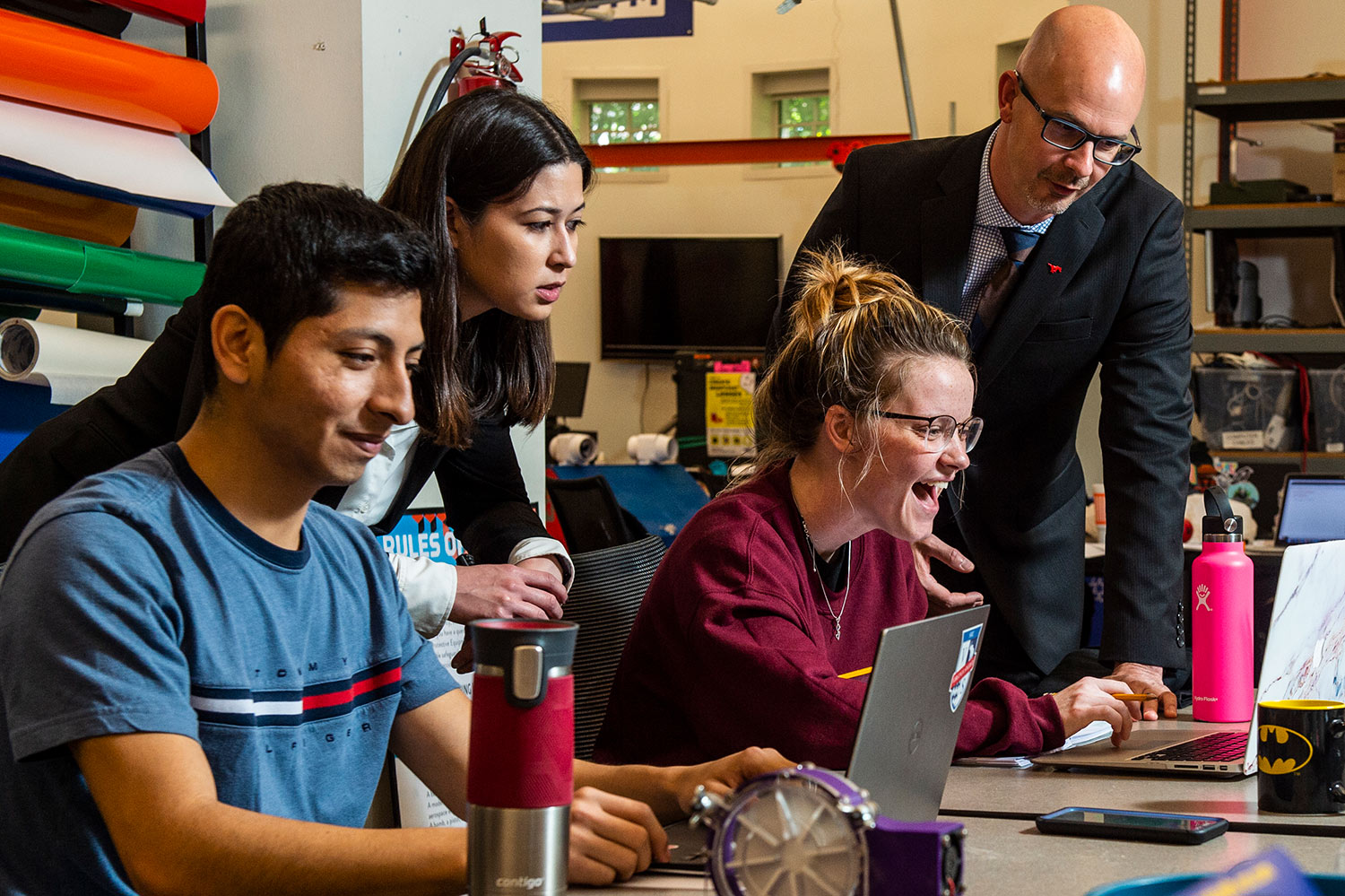 Students working with professor.