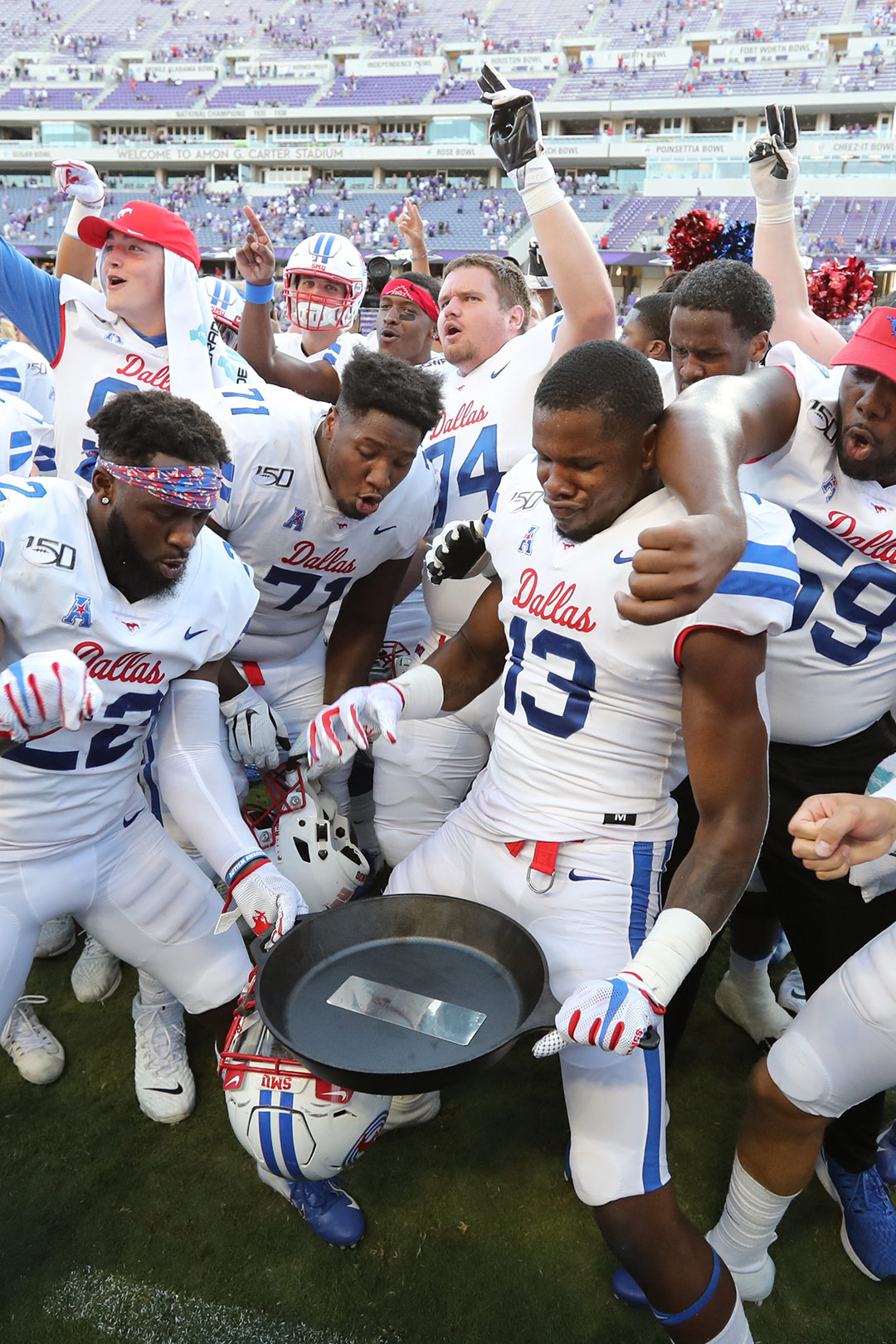 SMU football players celebrating the victory over TCU.