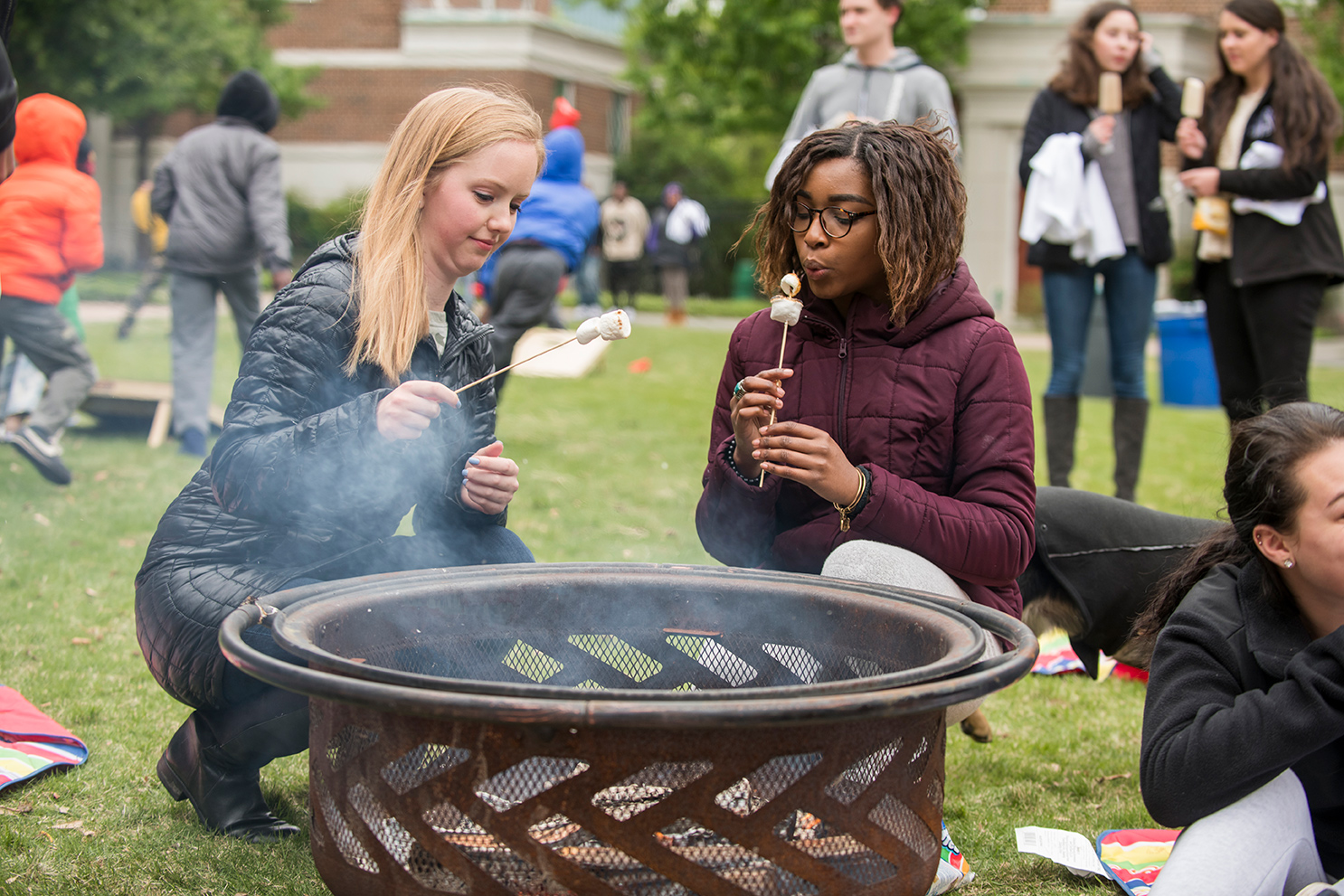 People toasting marshmellows.