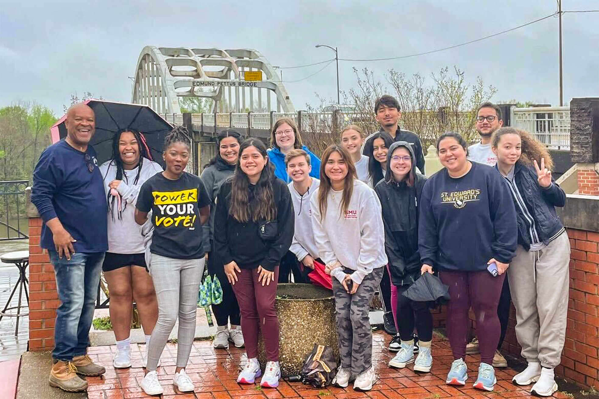 students and staff in front of the Edmund Pettus Bridge in Selma, Alabama