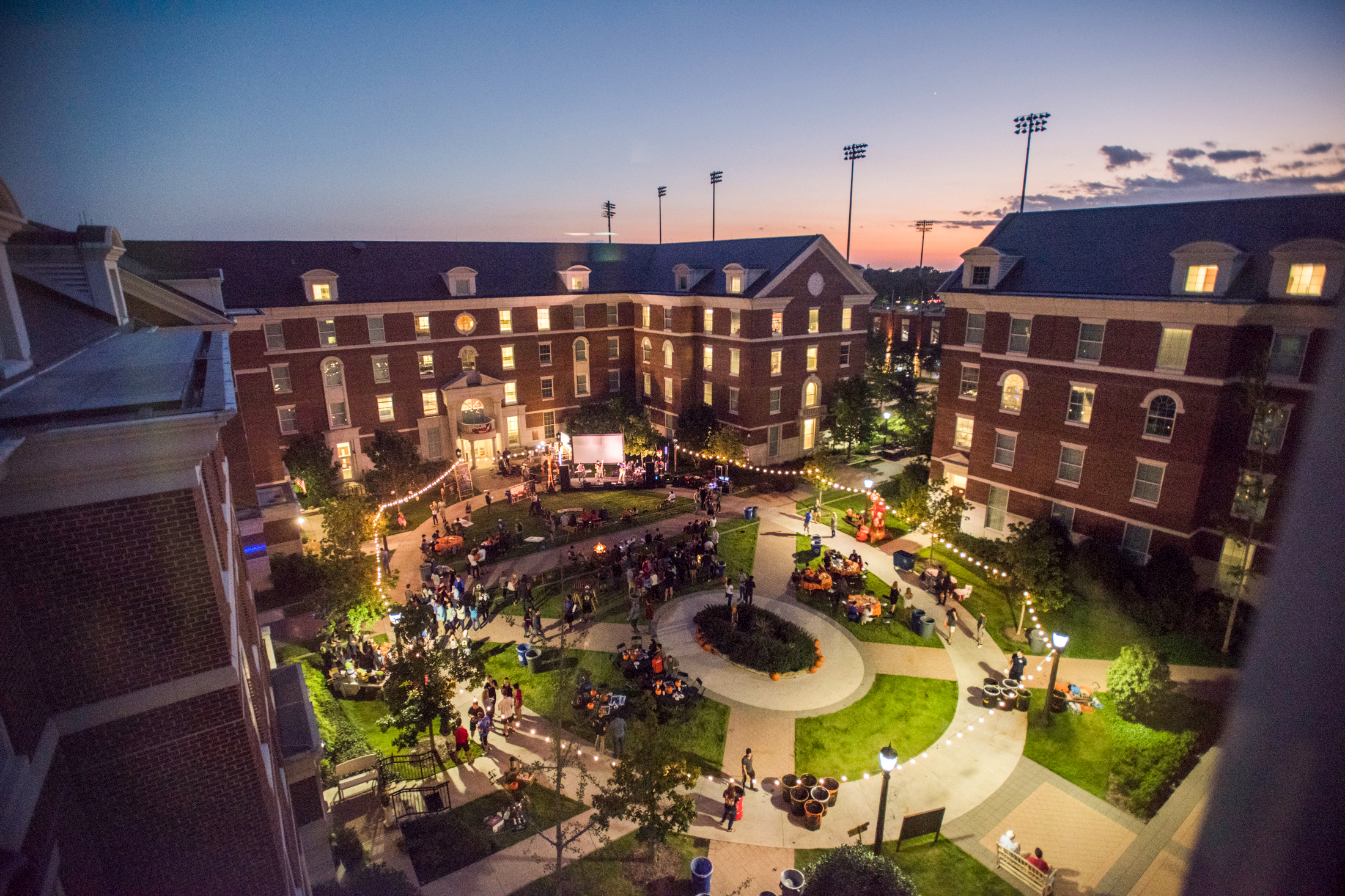 Kathy Crow Commons lawn nighttime arial shot of event