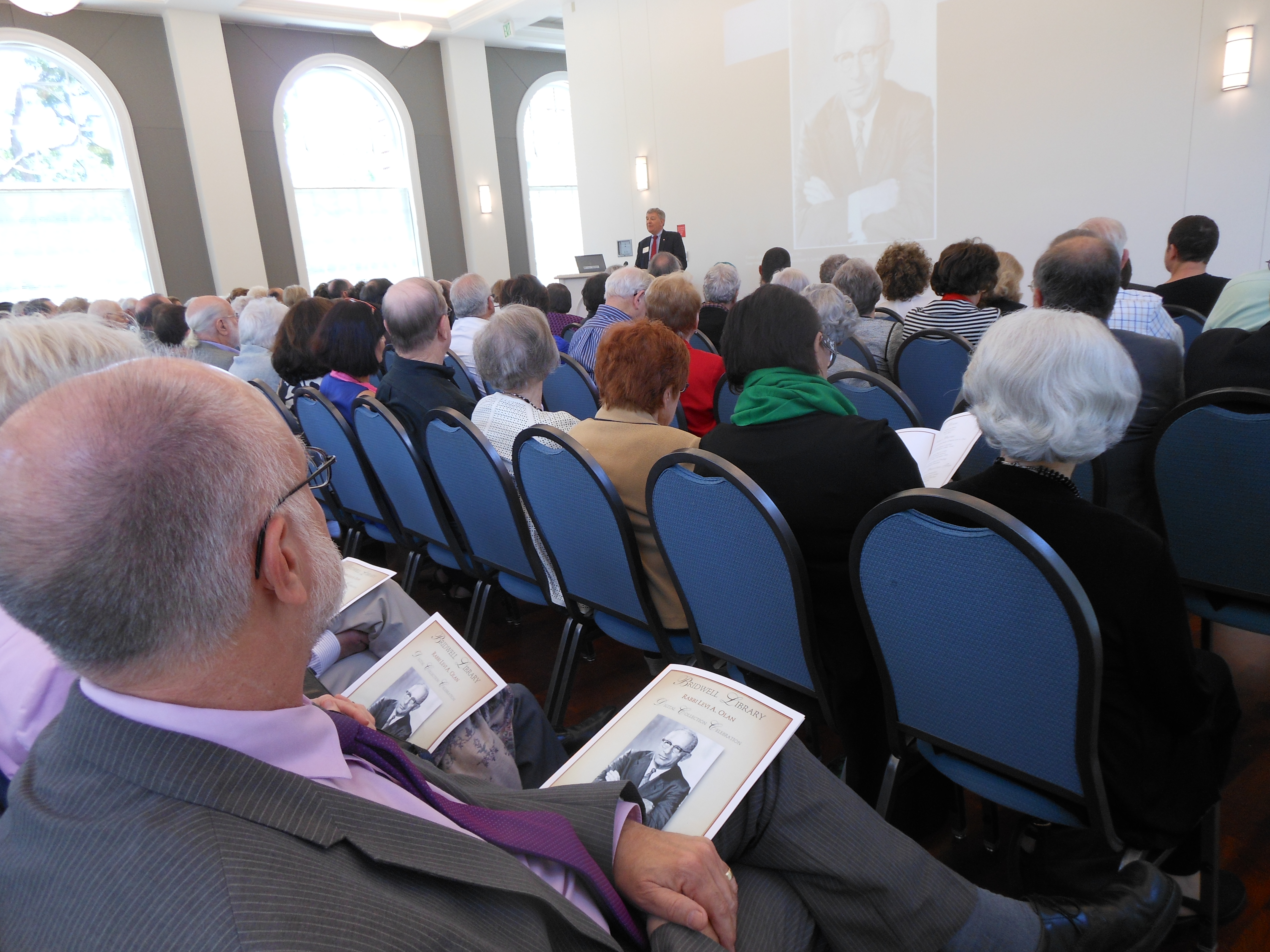 John Holbert (foreground) listens to Dean William B. Lawrence's Introduction