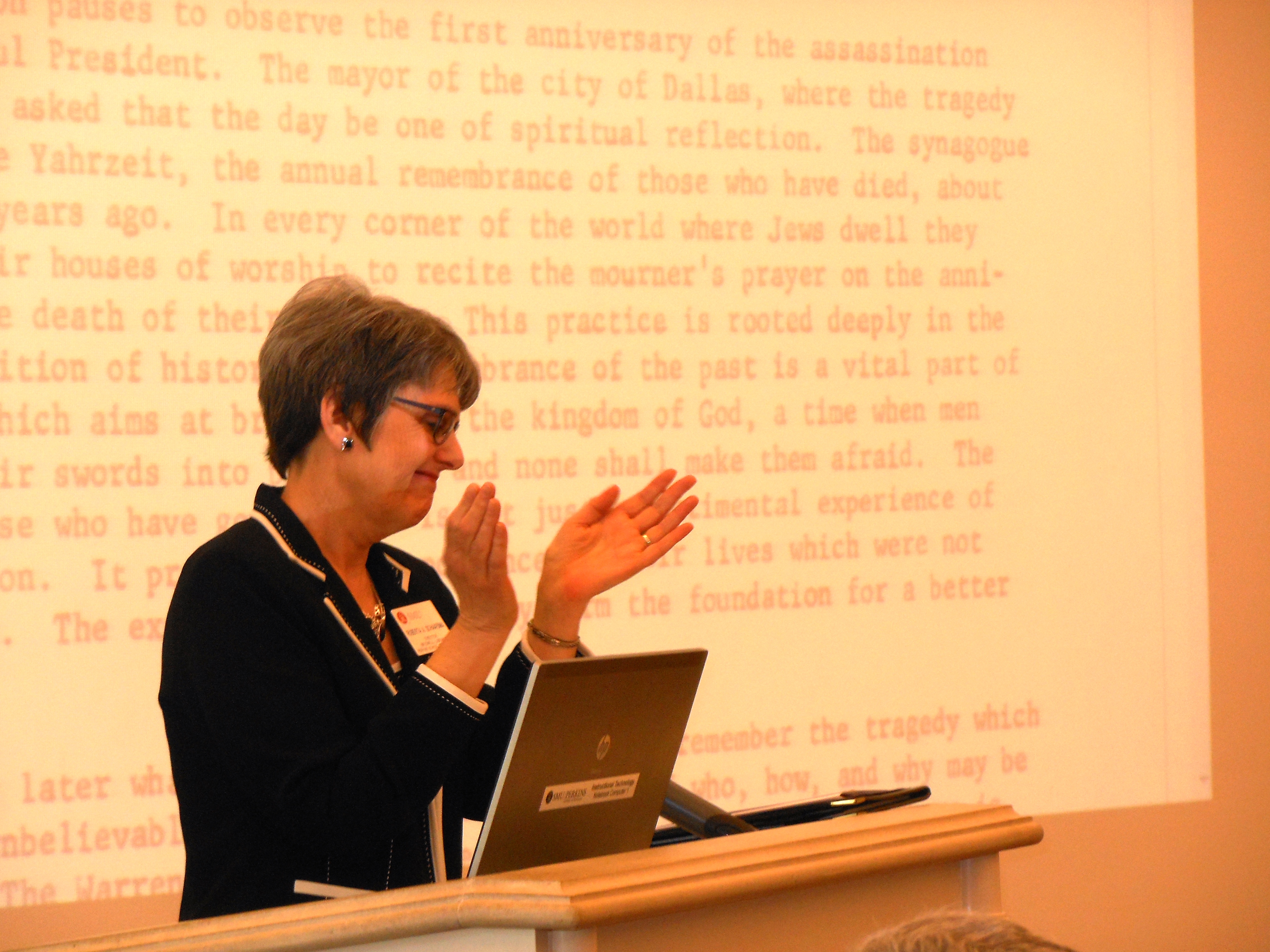 Roberta A. Schaafsma, Director and J.S. Bridwell Foundation Endowed Librarian, join the audience in applause